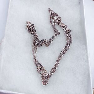 Long herringbone flat twisted Sterling silver chain necklace.